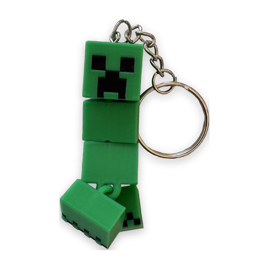 Green articulated creeper keychain on a split ring