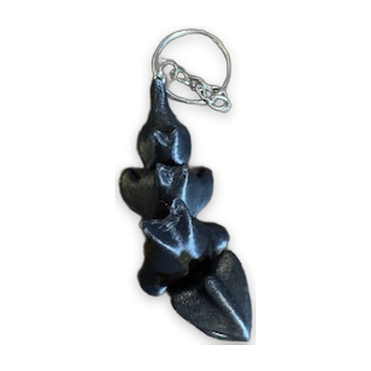 Dragon keychain hanging, showing the spined back