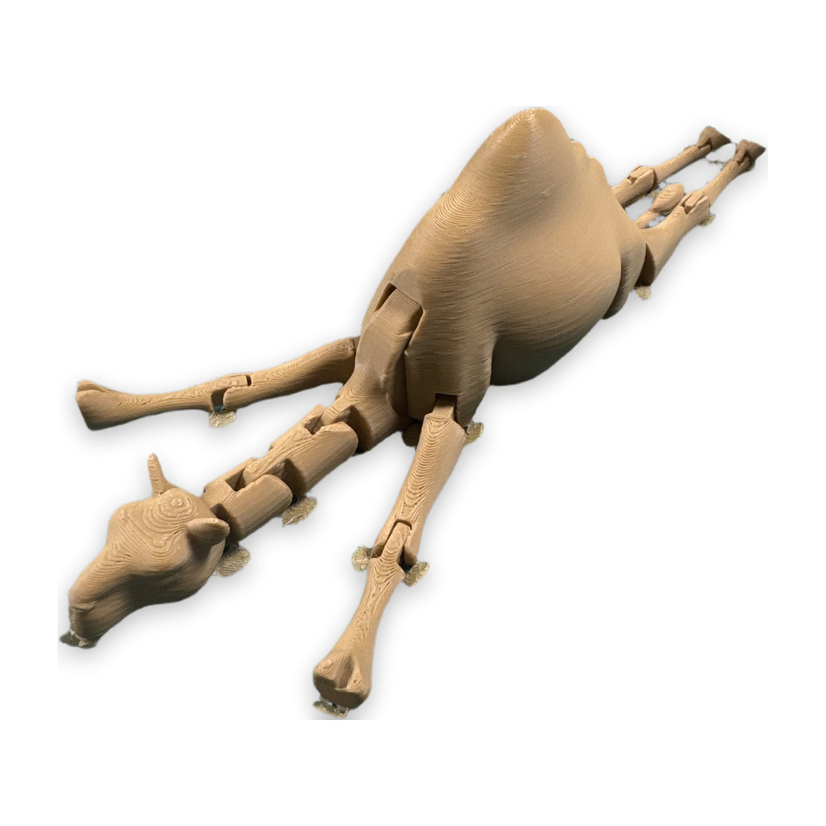 Large articulated camel figure in tan