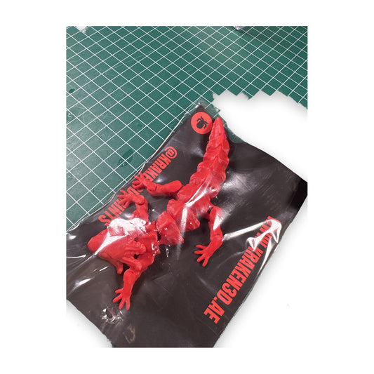 Red articulated lizard in Kraken packaging