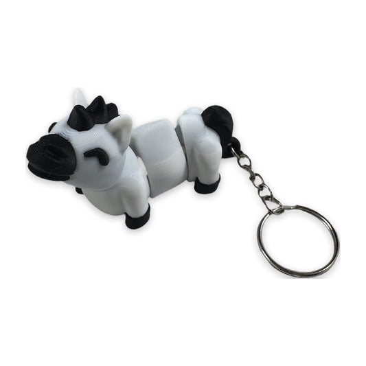 Articulated white pony keychain with black mane